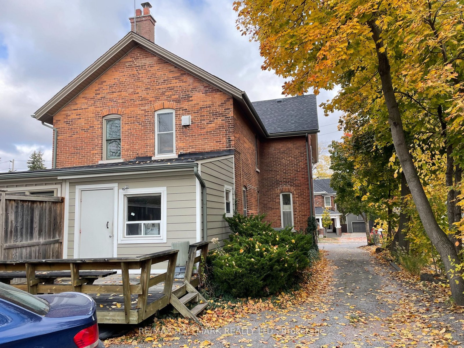 Rear gable elevation in original brick with small clapboard rear addition